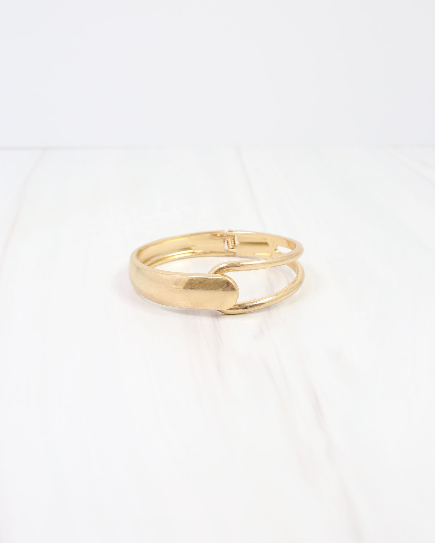 Ithaca Hinged Bangle Bracelet Worn Gold